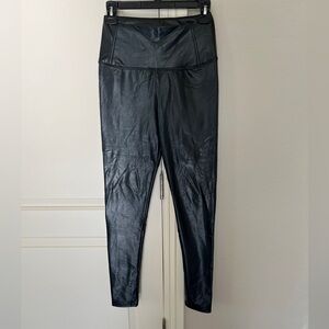 Black leather - like long tight leggings . New! Super soft lining ! Look great!